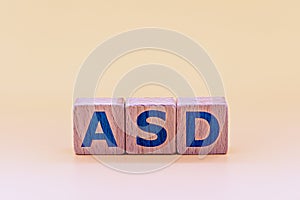 Photo on ASD autism spectrum disorders theme. wooden cubes with the abbreviation