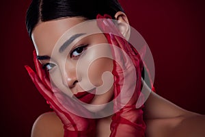 Photo of asian young lady femme fatale touch face lace gloves visage shoulders off isolated dark red color background