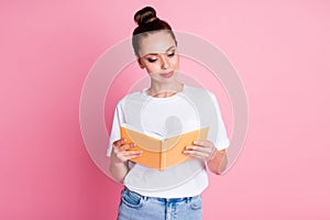 Photo of attentive girl read book have free time wear good look clothes isolated over pink color background