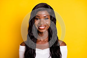 Photo of attractive afro american young woman attractive smile isolated on shine yellow color background