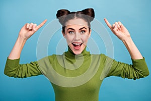 Photo of attractive amazed funny teen lady good mood indicating fingers hairdo advising cool hair stylist wear warm