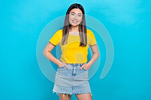 Photo of attractive asian girl model wear yellow t-shirt denim short skirt advertise clothes isolated blue teal color