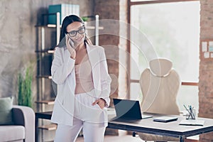 Photo of attractive beautiful business lady self-confident person talking partners communicating telephone home spacious