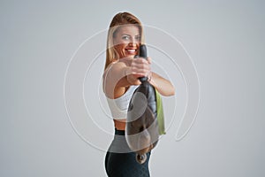 Photo of attractive blonde woman doing training with sandbag