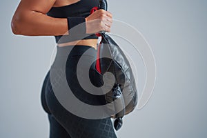 Photo of attractive blonde woman doing training with sandbag