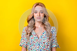 Photo of attractive confident serious cute woman dressed flowers print sarafan isolated on yellow color background