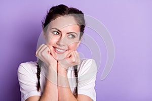 Photo of attractive dreamy young woman good mood smile look empty space isolated on purple color background
