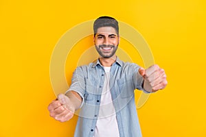 Photo of attractive man wear denim shirt smiling driving car test isolated bright yellow color background
