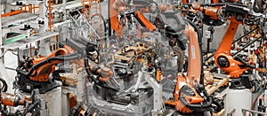 Photo of automobile production line. Modern car assembly plant. Modern and high-tech automotive industry