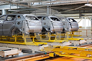 Photo of automobile production line. Welding car body. Modern car assembly plant. Auto industry. High-tech factory