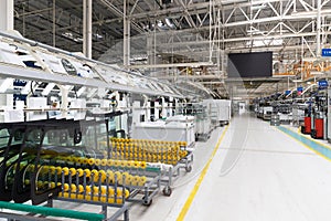 Photo of automobile production line. Welding car body. Modern car assembly plant. Auto industry. Interior of a high-tech