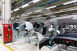 Photo of automobile production line. Welding car body and parts. Modern car assembly plant. Auto industry