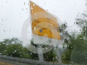 A photo of an AutoRoute board blurred by the raindrops on the window