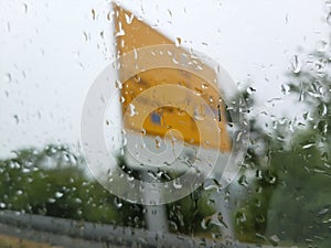 A photo of an AutoRoute board blurred by the raindrops on the window photo