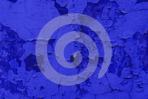 Photo background of old cracked plaster. Grunge background. Classic Blue