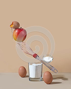 Photo balance. concept - ingredients for cooking apple pie. Flour, eggs, sugar