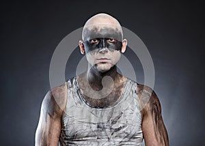 Photo of bald dirty man on gray background