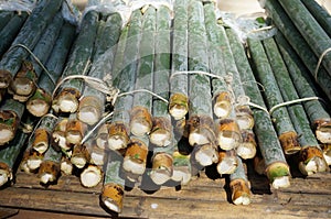 A photo of bamboo rice on bamboo table