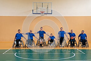 photo of the basketball team of war invalids with professional sports equipment for people with disabilities on the