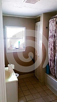 Before Photo of a Bathroom in Need of a Total Gut Job to Modernize It photo