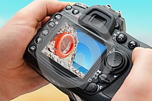 Photo of beach on camera display during the summer vacation.