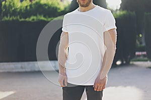 Photo Bearded Muscular Man Wearing White Blank t-shirt. Green Garden Outdoor Background. Blurred. Horizontal Mockup