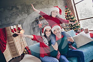 Photo of beautiful carefree friendly family arms wings have fun sit sofa festive newyear decor house indoors