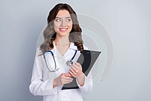 Photo of beautiful cheerful professional doc practitioner lady hold patient papers medical prescriptions look interested