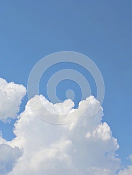 A photo of beautiful clouds against a bright blue sky. copy space and negativ space