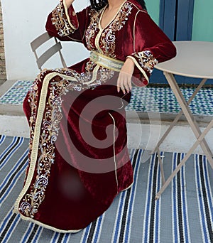 Photo of a beautiful girl in moroccan caftan takchita photo