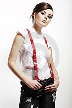 Photo of beautiful girl stretching suspenders