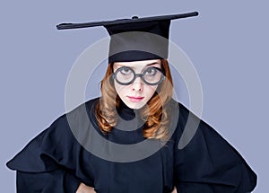 Photo of beautiful young alumnus in black suit on the wonderful photo