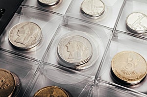 Photo of a belgian coins in a clear plastic sheet holder