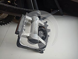 Photo of a bicycle pedal crank made of aluminum in black color