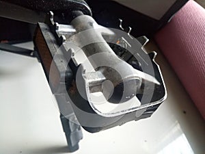 Photo of a bicycle pedal crank made of aluminum in black color