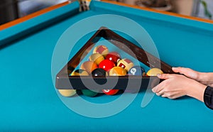 Photo of a billiard table with all items arranged by someone