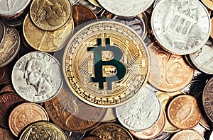 Photo of a bitcoin coin surrounded by world coins