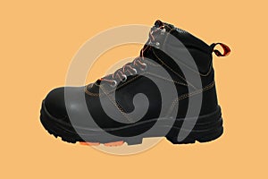 photo Black boots made of leather with a color background