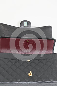 Photo of black Chanel handbag brand Editorial on white background.