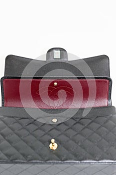 Photo of black Chanel handbag brand Editorial on white background.