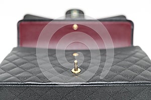 Photo of black Chanel handbag brand Editorial on white background.