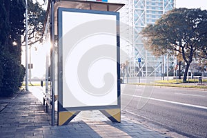 Photo blank lightbox on bus stop in the modern city. Horizontal mockup, sunlight