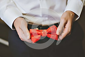 Photo of a blue suit with white shirt and red tie