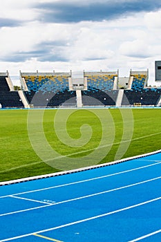 Photo of blue tracking field on stadium
