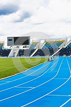 Photo of blue tracking field on stadium