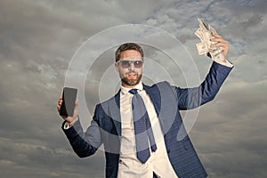 photo of bookmaker man with money. bookmaker man with money on sky background. photo