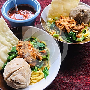 photo 2 bowls of chicken mie bakso with extra chicken weed ready to be served photo