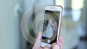 Photo of bride on smartphone