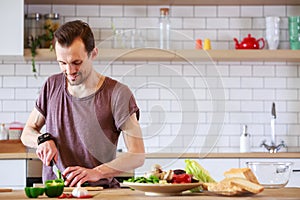 Photo of brunet cooking vegetables on table