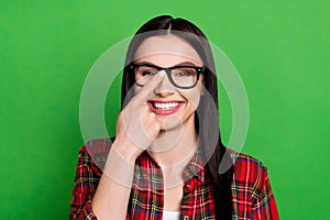 Photo of brunette smart young lady touch spectacles wear red shirt isolated on green color background